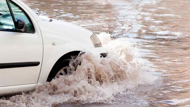 car drives into flood water